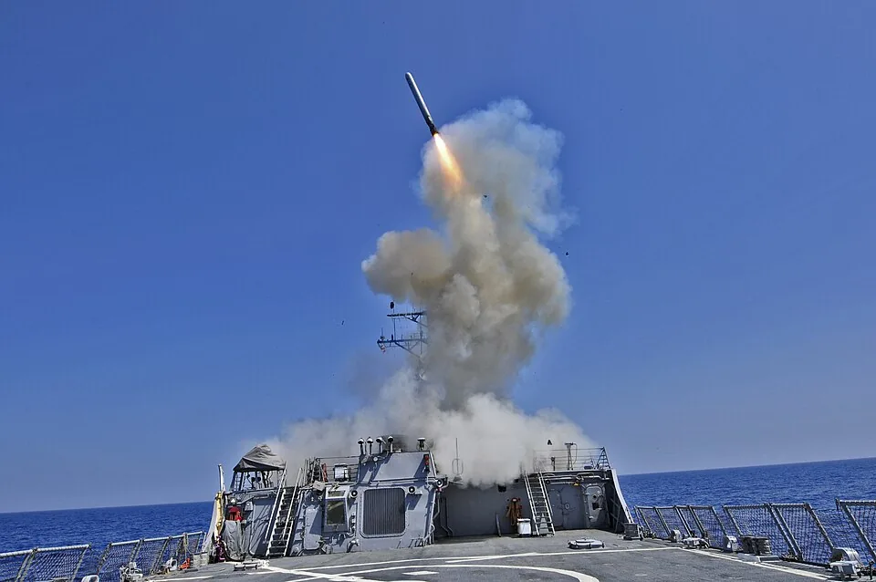 US Navy 110329-N-XO436-010 The Arleigh Burke-class guided-missile destroyer USS Barry (DDG 52) launches a Tomahawk cruise missile to support Joint