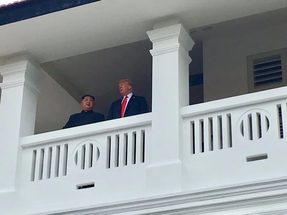 Trump and Kim chatting on balcony
