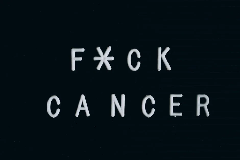 Motivational anti-cancer message on a letter board, emphasizing awareness.