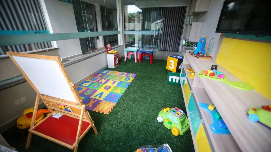 Bright indoor playroom filled with educational toys and activities, ideal for children.