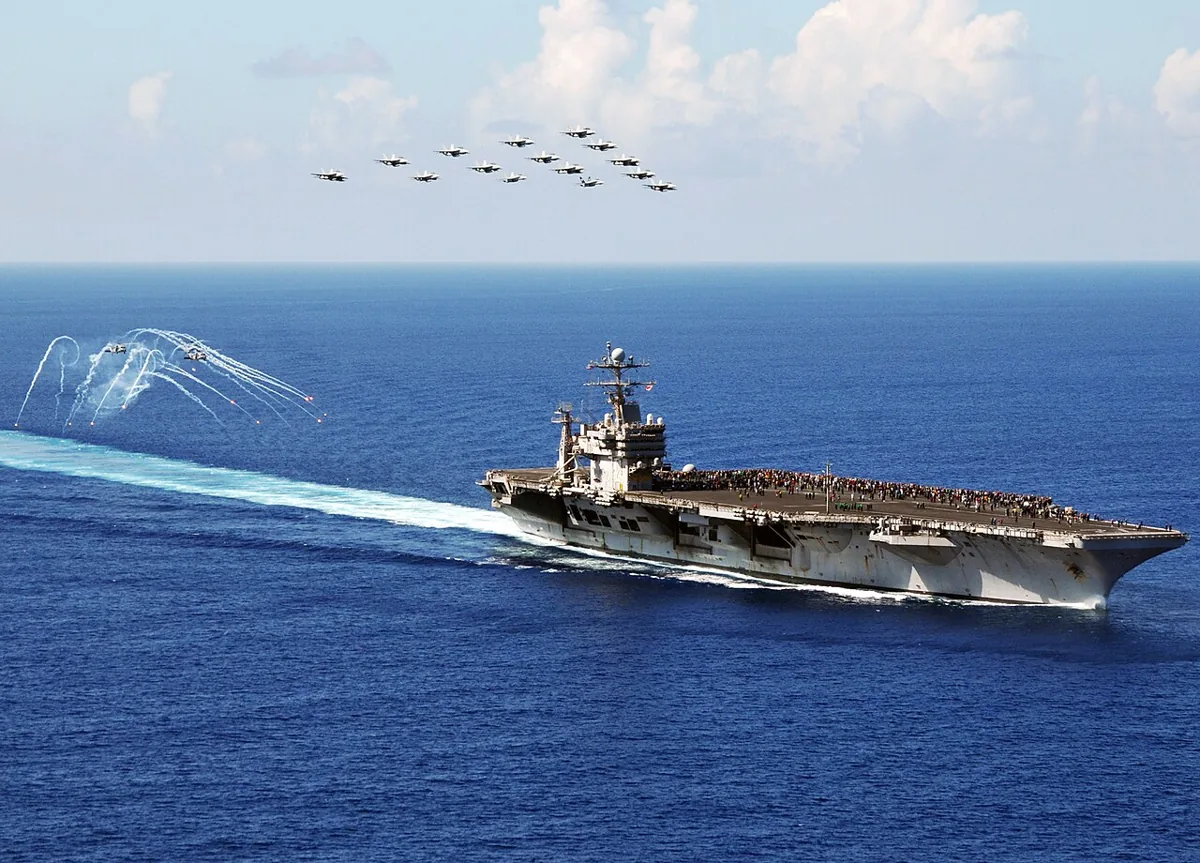 Flickr - Official U.S. Navy Imagery - Jets fly in formation above USS Abraham Lincoln.
