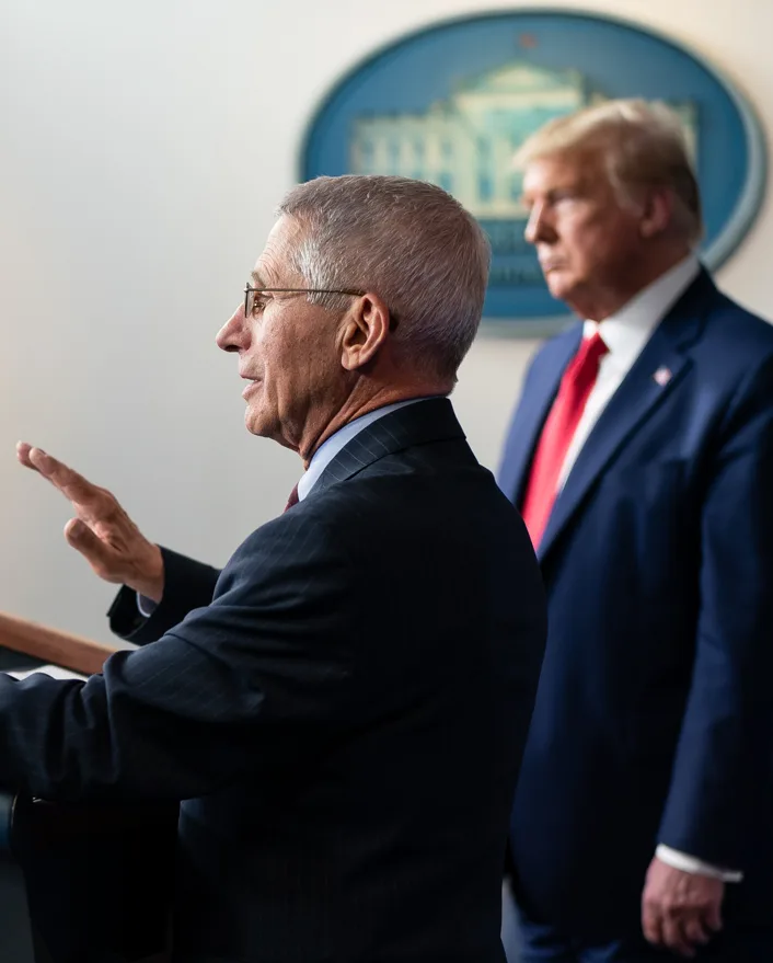 Anthony Fauci and Donald Trump in March 31, 2020 face detail, from- White House Coronavirus Update Briefing (49723232743) (cropped)